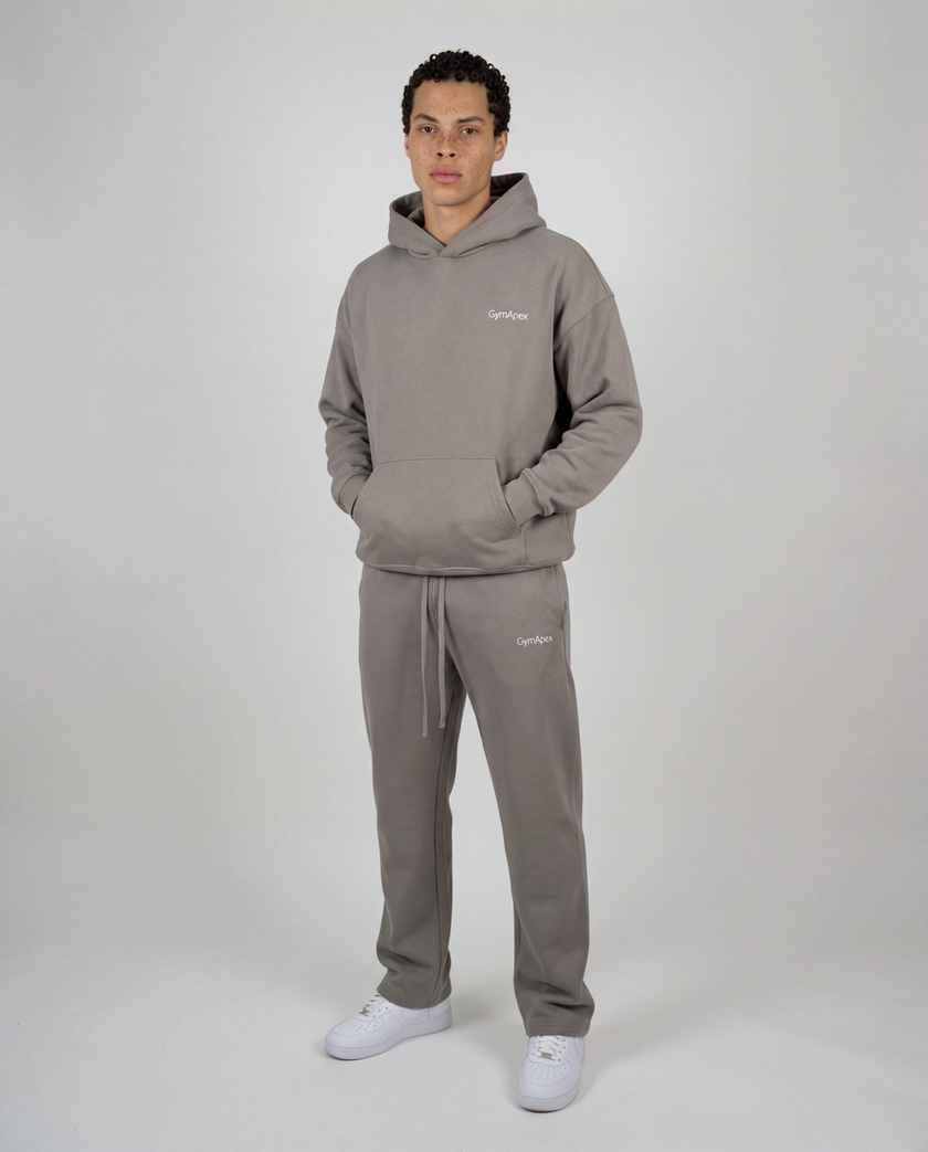 GymApex catalogue model wearing the Active Hoodie and Active Jogger, showing where to measure
